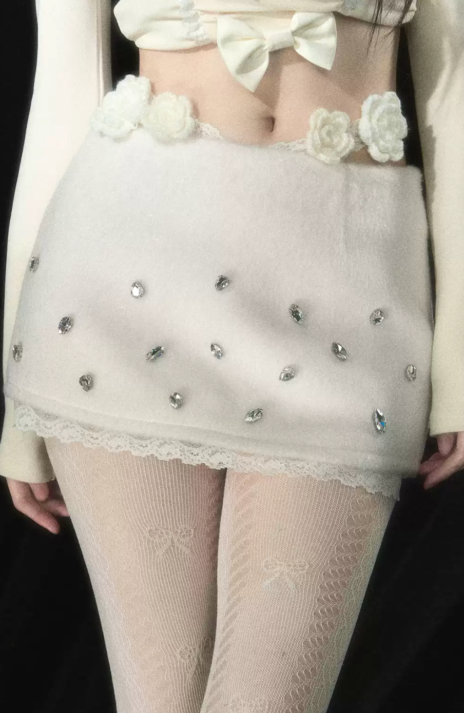 Lace mini skirt with flower and stone details