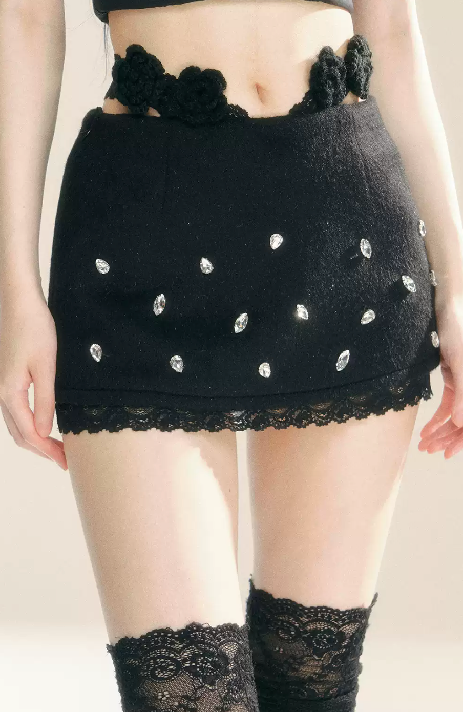 Lace mini skirt with flower and stone details