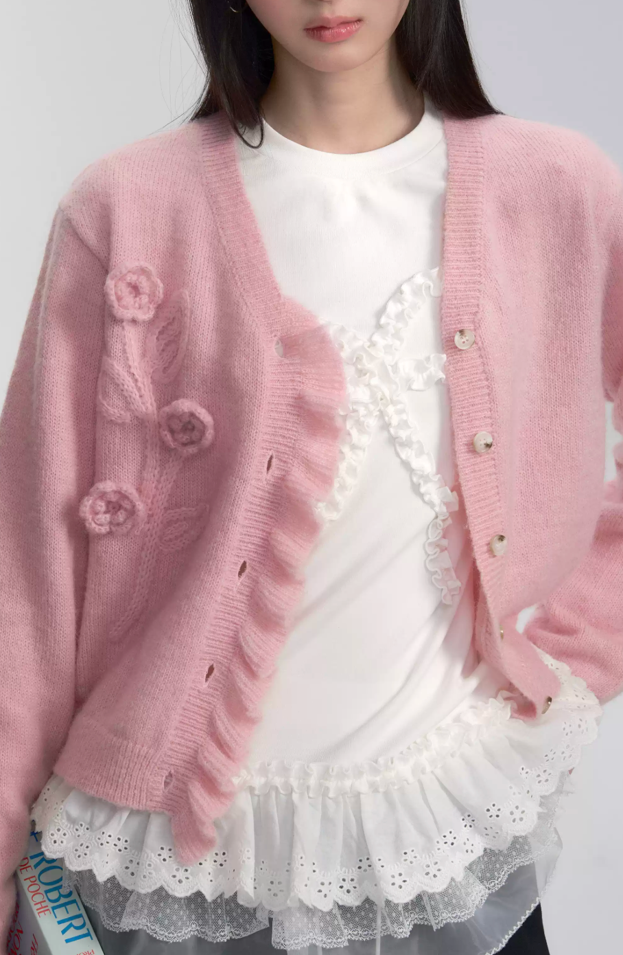 Pink hand-crocheted knitted cardigan with flower details